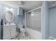 Full bathroom offering updated vanity, toilet and tub with glass enclosure at 2978 Legislative Ln, Buford, GA 30519