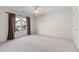 Spacious empty bedroom with carpet flooring, a ceiling fan, and a window view at 2978 Legislative Ln, Buford, GA 30519