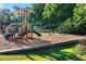 Community playground featuring slides, swings, and climbing structures, set in a landscaped yard at 2978 Legislative Ln, Buford, GA 30519