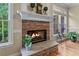 Cozy stone fireplace with a mantel, creating a warm and inviting atmosphere in the home at 2978 Legislative Ln, Buford, GA 30519