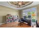 Bright home office with tray ceiling, hardwood floors, and views of the neighborhood at 2978 Legislative Ln, Buford, GA 30519