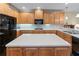 Spacious kitchen with wood cabinets, a center island, and modern appliances at 2978 Legislative Ln, Buford, GA 30519