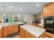Spacious kitchen features an island, plenty of cabinet space, and views into the dining and living room at 2978 Legislative Ln, Buford, GA 30519