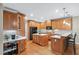 Spacious kitchen featuring wooden cabinets, modern appliances, a central island, and desk space at 2978 Legislative Ln, Buford, GA 30519