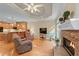 Inviting living room with a stone fireplace, comfortable seating, and an open layout to the kitchen at 2978 Legislative Ln, Buford, GA 30519