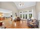 Spacious living room with hardwood floors, high ceilings, and doors leading to the outdoor deck at 2978 Legislative Ln, Buford, GA 30519