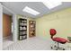 Office space in the basement featuring a desk, bookshelves, and unique flooring at 2978 Legislative Ln, Buford, GA 30519