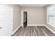 Well-lit bedroom showcasing gray floors and neutral-toned walls for a serene space at 6755 Biscayne Blvd, Rex, GA 30273