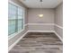 The dining room features modern flooring, a window that provides natural light and neutral paint at 6755 Biscayne Blvd, Rex, GA 30273