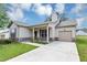 Inviting home with a covered porch, attached garage, and a neatly paved driveway at 6755 Biscayne Blvd, Rex, GA 30273