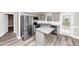 Modern kitchen featuring stainless steel appliances, granite countertops, and an island at 6755 Biscayne Blvd, Rex, GA 30273