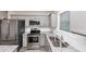 Well-appointed kitchen featuring stainless steel appliances, granite countertops, and ample cabinet space at 6755 Biscayne Blvd, Rex, GA 30273