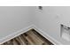 Unfinished laundry room featuring modern flooring and electrical outlet for both washer and dryer at 6755 Biscayne Blvd, Rex, GA 30273