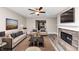 Cozy living room featuring stylish decor, modern furniture, and a stone fireplace at 6755 Biscayne Blvd, Rex, GA 30273