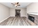 Large living room featuring a fireplace, modern flooring, and an open layout at 6755 Biscayne Blvd, Rex, GA 30273