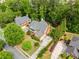 Aerial view of a beautiful home nestled among lush greenery, showcasing its spacious backyard at 940 Kinghorn Nw Dr, Kennesaw, GA 30152