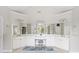 Elegant bathroom with double vanities, a center makeup area, and framed mirrors at 940 Kinghorn Nw Dr, Kennesaw, GA 30152