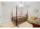 Comfortable bedroom showcases a four-poster bed, soft lighting, and a serene ambiance for rest at 940 Kinghorn Nw Dr, Kennesaw, GA 30152