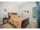 Inviting bedroom featuring a leather headboard and floral bedding creating a restful and stylish space at 940 Kinghorn Nw Dr, Kennesaw, GA 30152