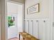 Welcoming entryway with wainscoting, bench seating, and decorative accents for a warm arrival at 940 Kinghorn Nw Dr, Kennesaw, GA 30152