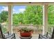 Inviting front porch with rocking chairs and a plant, offering a relaxing outdoor space at 940 Kinghorn Nw Dr, Kennesaw, GA 30152