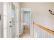 Hallway featuring a french door leading into a brightly painted blue room at 940 Kinghorn Nw Dr, Kennesaw, GA 30152