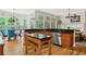 Bright kitchen with granite countertops, wood floors, an island, and an adjacent breakfast nook at 940 Kinghorn Nw Dr, Kennesaw, GA 30152