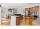 Spacious kitchen features wood cabinets, stainless steel appliances, granite countertops, and breakfast nook at 940 Kinghorn Nw Dr, Kennesaw, GA 30152