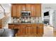 Gourmet kitchen features stainless steel appliances, wood cabinets, and a decorative tile backsplash at 940 Kinghorn Nw Dr, Kennesaw, GA 30152