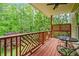 Relaxing porch featuring wooded views, comfortable seating, and an overhead ceiling fan at 940 Kinghorn Nw Dr, Kennesaw, GA 30152