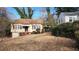 Charming single-Gathering home with a tidy front yard and an unfinished basement garage at 1235 Westboro Sw Dr, Atlanta, GA 30310