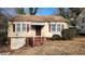 Charming single-Gathering home with a tidy front yard and an unfinished basement garage at 1235 Westboro Sw Dr, Atlanta, GA 30310