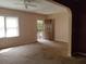 Bright living room featuring a ceiling fan, large window, and ample natural light at 1235 Westboro Sw Dr, Atlanta, GA 30310