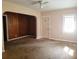 Bright living room featuring a ceiling fan, large window, and ample natural light at 1235 Westboro Sw Dr, Atlanta, GA 30310