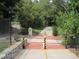 A community walking path with painted crosswalks for safety at 1235 Westboro Sw Dr, Atlanta, GA 30310