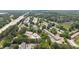 Aerial view of the community featuring residential buildings, green spaces, and access to a nearby interstate at 238 Chads Ford Way, Roswell, GA 30076
