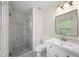 Bathroom features a stand up shower with glass door and a white vanity at 238 Chads Ford Way, Roswell, GA 30076