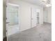Bathroom with stand up glass shower, white walls, and grey carpet at 238 Chads Ford Way, Roswell, GA 30076