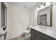 Well-lit bathroom with modern vanity, toilet, and a laundry area with modern washer and dryer appliances at 238 Chads Ford Way, Roswell, GA 30076