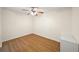 Bedroom with hard wood floors, a ceiling fan and a white dresser at 238 Chads Ford Way, Roswell, GA 30076