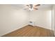 A well lit bedroom with hardwood floors and a white ceiling fan at 238 Chads Ford Way, Roswell, GA 30076