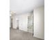 Bedroom featuring a closet, ensuite bathroom with a tiled shower, carpet flooring and neutral walls at 238 Chads Ford Way, Roswell, GA 30076