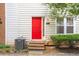 A charming exterior shot shows a red front door with a tidy yard and manicured bushes at 238 Chads Ford Way, Roswell, GA 30076
