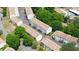 Aerial view of townhome row in Holcomb's Crossing highlighting the well-maintained exterior and green spaces at 238 Chads Ford Way, Roswell, GA 30076
