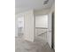 Hallway featuring carpet flooring, closet and stairway to a second floor, providing a seamless transition between spaces at 238 Chads Ford Way, Roswell, GA 30076