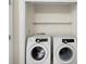 Convenient laundry closet with Samsung washer and dryer and built-in shelving for storage at 238 Chads Ford Way, Roswell, GA 30076