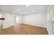 Spacious living room with new floors and a window letting in natural light at 238 Chads Ford Way, Roswell, GA 30076