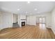 Cozy living room showing fireplace and staircase with an open view to the dining room at 238 Chads Ford Way, Roswell, GA 30076