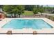 Community pool with safety equipment, brick pillars, fence, and trees, providing a relaxing retreat at 238 Chads Ford Way, Roswell, GA 30076