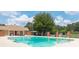 Outdoor pool with chairs and umbrellas at Holcomb's Crossing offers a refreshing amenity at 238 Chads Ford Way, Roswell, GA 30076